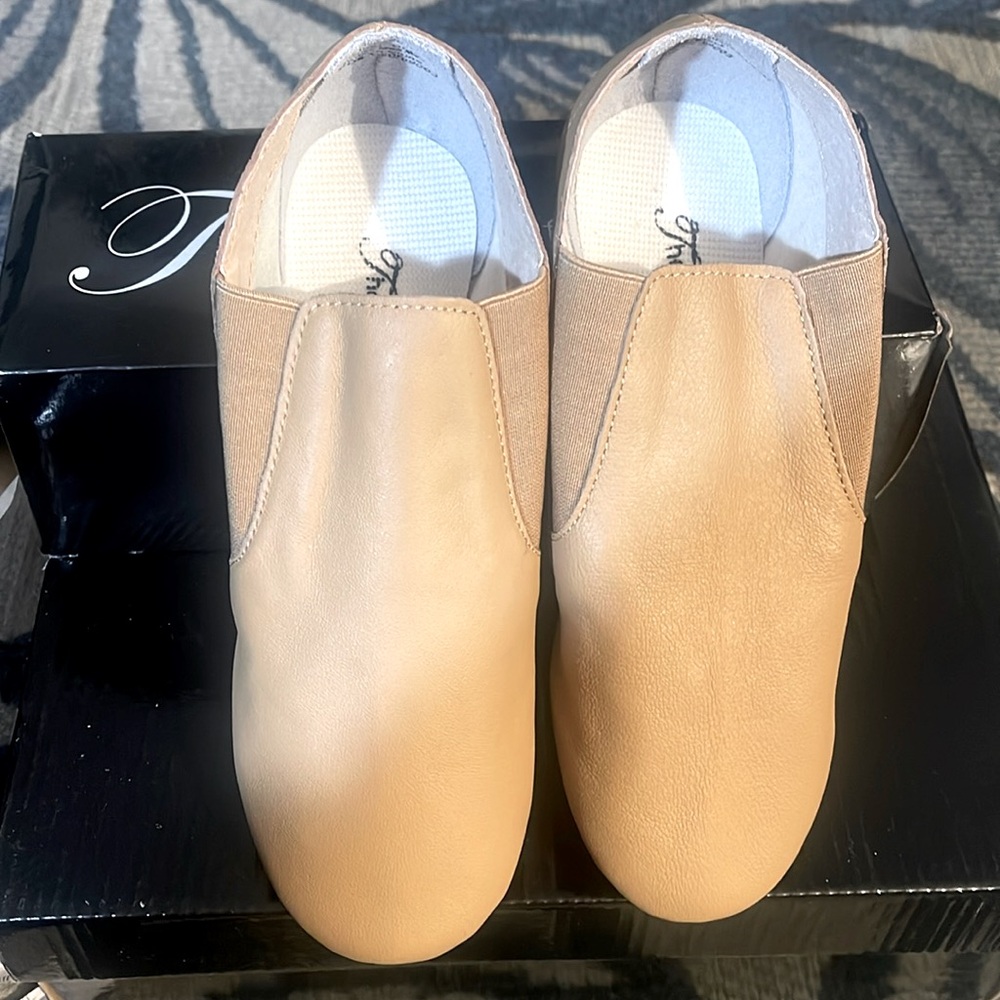 Theatricals slip-on jazz shoe
Tan color various sizes 
Never worn with box.